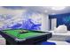 Spacious game room featuring a pool table and unique mountain-themed wall art at 3880 Sonoma Blvd, Kissimmee, FL 34741