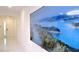 Bright hallway featuring white marble floors and a large screen TV with a scenic nature display at 3880 Sonoma Blvd, Kissimmee, FL 34741