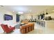 Spacious living room showcases modern furniture, sleek tile floors, and contemporary lighting fixtures at 3880 Sonoma Blvd, Kissimmee, FL 34741