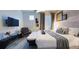 Serene primary bedroom featuring modern décor, a comfortable bed, and a TV at 3880 Sonoma Blvd, Kissimmee, FL 34741