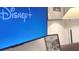Entertainment setup with a large flat-screen TV showcasing Disney+ streaming service at 3880 Sonoma Blvd, Kissimmee, FL 34741