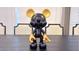 Artistic Mickey Mouse statue on a large wooden table at 3880 Sonoma Blvd, Kissimmee, FL 34741