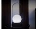 Modern table lamp on a dark round table with matching wooden doors at 3880 Sonoma Blvd, Kissimmee, FL 34741