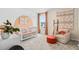 Adorable Bedroom with a cute crib, accent wall, and comfortable seating for a cozy and inviting space at 405 Meadowland Pt, Oviedo, FL 32765