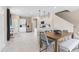 Well-lit kitchen and dining area with modern fixtures and stainless steel appliances at 405 Meadowland Pt, Oviedo, FL 32765