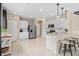 Bright, modern kitchen with stainless steel appliances and a center island with bar seating at 405 Meadowland Pt, Oviedo, FL 32765