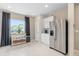 Modern kitchen featuring a stainless steel refrigerator and ample cabinet space at 405 Meadowland Pt, Oviedo, FL 32765