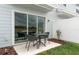 A cozy patio with outdoor seating and a view of the backyard, creating a relaxing outdoor space at 405 Meadowland Pt, Oviedo, FL 32765