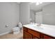 Bright bathroom features a white vanity, large mirror, and essential toiletries for guests at 4114 Breakview Dr # 30702, Orlando, FL 32819