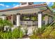 Outdoor community bar area featuring ample seating, a bar, and lush landscaping at 4114 Breakview Dr # 30702, Orlando, FL 32819
