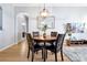 Bright dining area with wood floors, table, four chairs, stylish lighting and decor throughout at 4114 Breakview Dr # 30702, Orlando, FL 32819