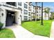 Attractive condominium entrance with well-maintained landscaping and exterior lighting at 4114 Breakview Dr # 30702, Orlando, FL 32819
