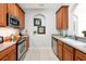 Efficient kitchen design with stainless steel appliances, light countertops, and ample cabinet space at 4114 Breakview Dr # 30702, Orlando, FL 32819