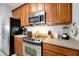 Efficient kitchen featuring stainless steel appliances, light countertops and ample cabinet space at 4114 Breakview Dr # 30702, Orlando, FL 32819