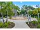 A community splash pad with ample seating surrounded by lush landscaping, perfect for cooling off on hot days at 4114 Breakview Dr # 30702, Orlando, FL 32819