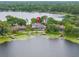 A waterfront home with private dock, screened in patio, and pool nestled on a serene lake setting at 4536 N Landmark Dr, Orlando, FL 32817