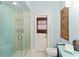 Stylish bathroom featuring a glass-enclosed shower and a unique mosaic tile design at 4536 N Landmark Dr, Orlando, FL 32817