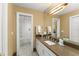Well-lit bathroom with a clean white vanity and a shower/tub combination at 4536 N Landmark Dr, Orlando, FL 32817