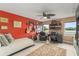Unique bedroom featuring a daybed, a ceiling fan, and multiple guitars on display at 4536 N Landmark Dr, Orlando, FL 32817