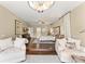 Large main bedroom featuring hardwood floors, sitting area, stylish furnishings, and a ceiling fan at 4536 N Landmark Dr, Orlando, FL 32817