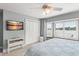 Serene bedroom featuring a bay window, a closet, and a calming blue decor at 4536 N Landmark Dr, Orlando, FL 32817
