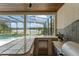 Outdoor kitchen area with granite countertops, a grill, and lake views at 4536 N Landmark Dr, Orlando, FL 32817