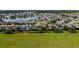 A Primary-planned community with a lake, well-maintained houses, and lush greenery at 4553 Baler Trails Dr, St Cloud, FL 34772