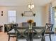 Dining room features table with seating for six and decorative chandelier at 4553 Baler Trails Dr, St Cloud, FL 34772