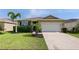 Charming single-Gathering home with an attached two-car garage, landscaped lawn, and neutral paint colors at 4553 Baler Trails Dr, St Cloud, FL 34772