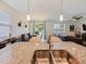Kitchen view with granite counters and stainless steel sink with an open living space concept at 4553 Baler Trails Dr, St Cloud, FL 34772