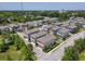Aerial view of a neighborhood with colorful houses and mature trees at 4630 Socrates Way, Sanford, FL 32773
