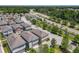 An aerial view showcases a neighborhood with modern homes, manicured landscaping, and convenient access to the main road at 4630 Socrates Way, Sanford, FL 32773
