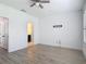 This bedroom features a ceiling fan and attached bathroom at 4630 Socrates Way, Sanford, FL 32773
