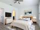 Well-lit bedroom with a modern design, plush rug, and a decorative wall hanging at 4630 Socrates Way, Sanford, FL 32773