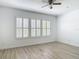 This bedroom features plantation shutters, wood floors, and white walls at 4630 Socrates Way, Sanford, FL 32773