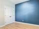 This bedroom features neutral paint, wood floors, and a closet with double doors at 4630 Socrates Way, Sanford, FL 32773