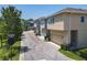 Street view of modern homes with neutral exteriors, attached garages, and well-maintained landscaping at 4630 Socrates Way, Sanford, FL 32773