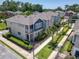 Aerial shot of modern homes with well-kept landscaping and a mix of neutral and blue exteriors at 4630 Socrates Way, Sanford, FL 32773