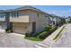 View of home exterior with an attached garage, manicured front yard, and a well-maintained sidewalk at 4630 Socrates Way, Sanford, FL 32773