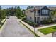 Exterior shot showing the side of the house, a charming balcony, and manicured lawn at 4630 Socrates Way, Sanford, FL 32773