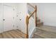 Bright staircase with wooden handrail and neutral flooring leading to the upper level at 4630 Socrates Way, Sanford, FL 32773