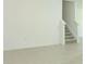Spacious hall with tile flooring and staircase at 4724 Cloister St, Kissimmee, FL 34758