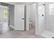 Modern bathroom featuring a walk-in shower with elegant tile work and sleek fixtures at 501 Marion Oaks Golf Way, Ocala, FL 34473
