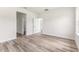 Bright bedroom boasts natural light, sleek wood floors, and a neutral color palette at 501 Marion Oaks Golf Way, Ocala, FL 34473