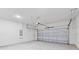 Spacious two car garage with white walls and a concrete floor at 501 Marion Oaks Golf Way, Ocala, FL 34473
