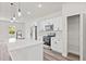 Kitchen showcasing stainless steel appliances, granite counters, and an island with pendant lights at 501 Marion Oaks Golf Way, Ocala, FL 34473