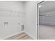 The laundry room has washer hookups next to a door leading to the garage at 501 Marion Oaks Golf Way, Ocala, FL 34473