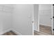 Spacious walk-in closet featuring wire shelving and easy access to other rooms at 501 Marion Oaks Golf Way, Ocala, FL 34473