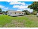 Well-maintained backyard featuring a neatly kept lawn, offering a serene outdoor space and great privacy at 5210 Poinsetta Ave, Winter Park, FL 32792