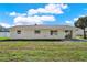 Spacious backyard with a lush lawn and a patio area, ideal for outdoor entertaining and relaxation at 5210 Poinsetta Ave, Winter Park, FL 32792